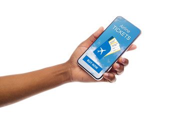 Application for booking flights on cellphone in black female hand