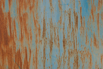 Fototapeta premium Abstract grunge background. Old rusty metal. Scratches and chips. Brown and blue colors.
