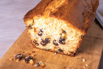 Closeup homemade sliced cake on a wooden board