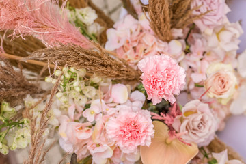 Wedding arch for ceremony outdoor with flower decoration and rustic design