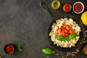 pasta with tomato sauce and sausages (Cavatappi, Elbow, Campanelle) serving second course. top food background. copy space