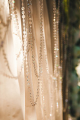 Obraz premium threads with rhinestones on fabric, light and shadow, bokeh - abstract background