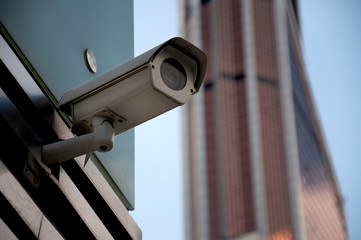 Security surveillance system at the entrance to a modern office building. Two cameras of video surveillance.