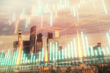 Obraz na płótnie Canvas Double exposure of financial graph on downtown veiw background. Concept of stock market research and analysis
