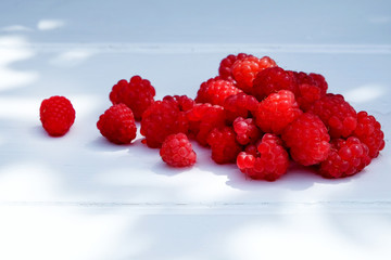 fresh raspberries on a white background