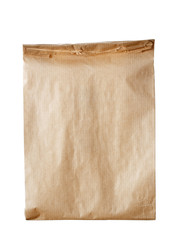 New empty blank paper bag without inscriptions and logos. Made from brown kraft paper. Isolated on white background.