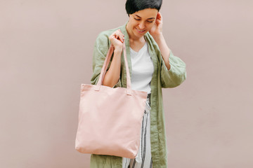 Woman holding canvas tote bag. Reusable eco bag. Eco friendly concept.