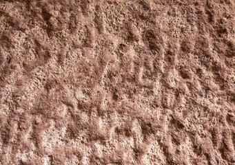 The texture of the  brown old monastery wall with cracks and scuffs