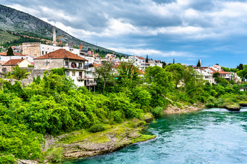 Fototapeta na wymiar Mostar town at the Neretva river in Bosnia and Herzegovina