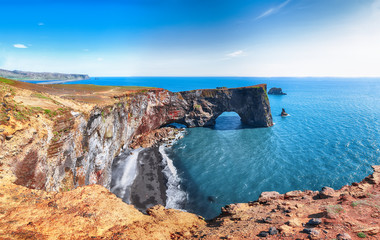 Gorgeous landscape with unique basalt arch on Dyrholaey Nature Reserve on Atlantic South Coast