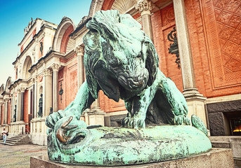 Bronze statue of a lion fighting against a snake (1832) in front of Ny Carlsberg Glyptotek in...