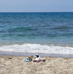 Mask, snorkel and beach Slippers on the sandy beach by the sea. Sea holidays in southern countries