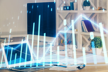 Stock market graph and table with computer background. Multi exposure. Concept of financial analysis.