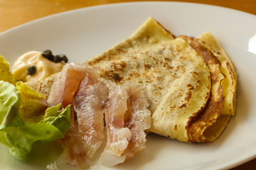 Gravlax with pancake served salad