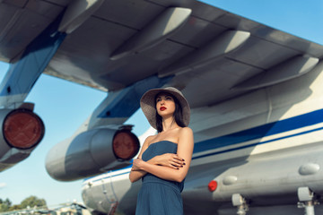 Brunette in a dress at the old airport