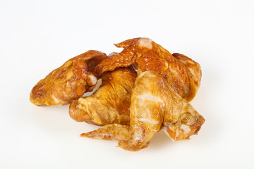 Smoked chicken wings over white background