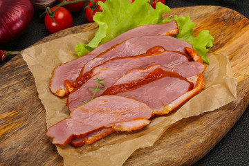 Sliced smoked duck breast served salad