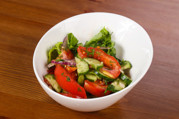 Vegetable salad with tomato, cucumbers