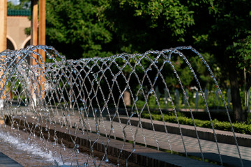 Sprinkling water of a fountain with detailed water drops