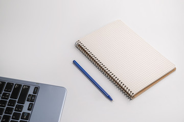 stationery, notebook and pen on a white background