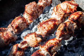 Meat fried on open fire. Barbeque close up