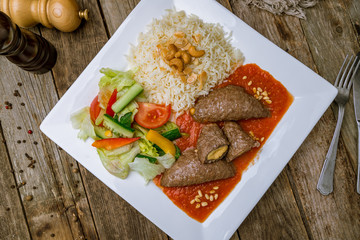 Cutlets with cheese in tomato sauce in Turkish