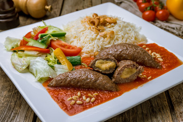 Cutlets with cheese in tomato sauce in Turkish