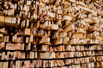 Stack of natural rough wooden boards. Wooden boards, lumber, industrial wood.