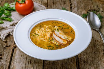 Chicken soup bouillon in a plate