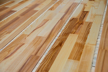 Production line of the wooden floor factory. CNC automatic woodworking machine.