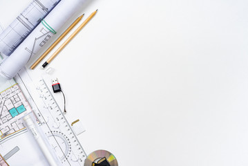 Architectural plans, pencil and ruler on the table. Place for your text