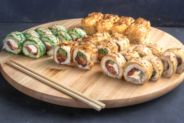 Japanese seafood sushi sets on wooden background and wooden chopsticks