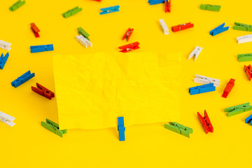 Colored clothespin papers empty reminder yellow floor background office