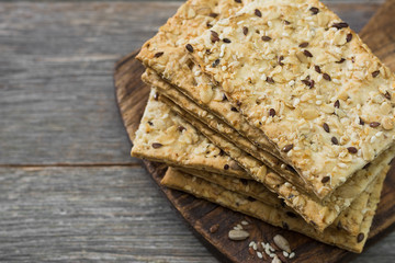 Grain loaves on a wooden Board on a wooden gray background. For healthy nutrition