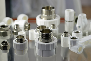 A variety of plumbing pipe connectors, fittings, adapters