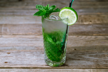 classic Mojito on old wooden table