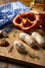 White german sausage, brezel, mustard and beer. Oktoberfest food. Traditional bavarian white...