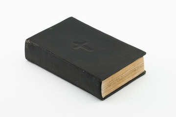 Antique vintage black bible book on white background