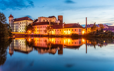 Fototapeta na wymiar Jindrichuv Hradec Castle by night. Reflection in the water. Czech Republic