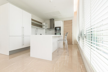 Stylish kitchen interior with dining table and chairs