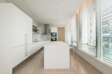 Stylish kitchen interior with dining table and chairs