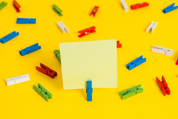 Colored clothespin papers empty reminder yellow floor background office