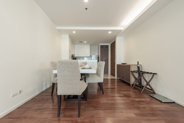 Stylish kitchen interior with dining table and chairs
