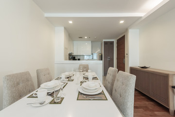 Stylish kitchen interior with dining table and chairs
