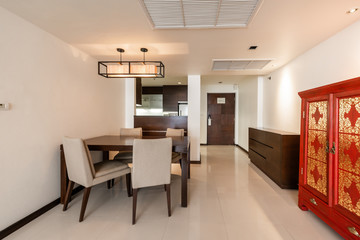 Stylish kitchen interior with dining table and chairs