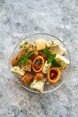 Different oriental sweets on glass plate. Top view. Baklava,halva.