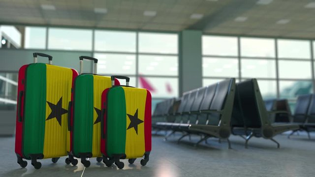 Travel suitcases with flag of Ghana. Ghanaian tourism conceptual 3D animation