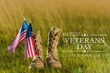 Military boots near American flag with stars and stripes on grass with veterans day illustration