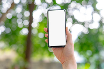 hand holding smart phone with blank screen isolated on white
