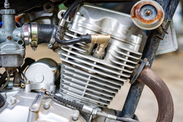 The engine of an old motorcycle that is still working normally